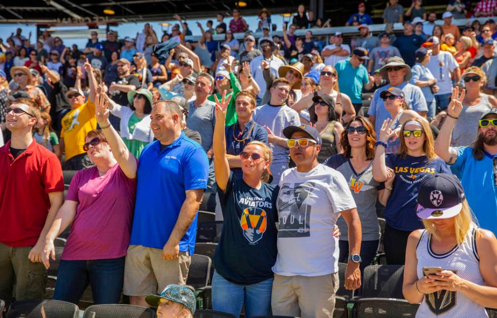 Aviators fans sing "take Me Out to the Ballpark" during a break in the game versus th ...