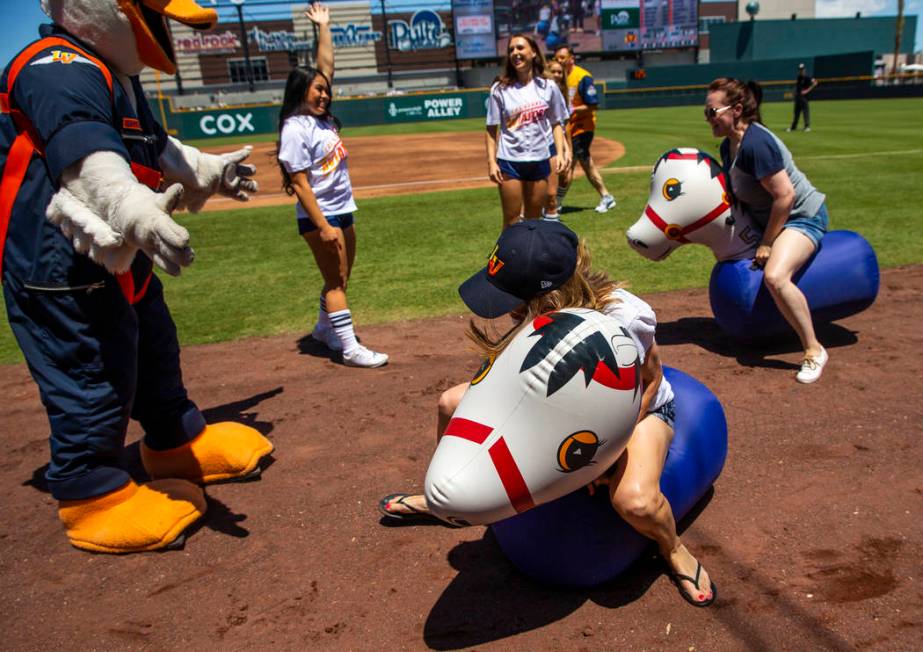 Aviators fans participate in a horse race during a break in the action versus the Tacoma Rainie ...