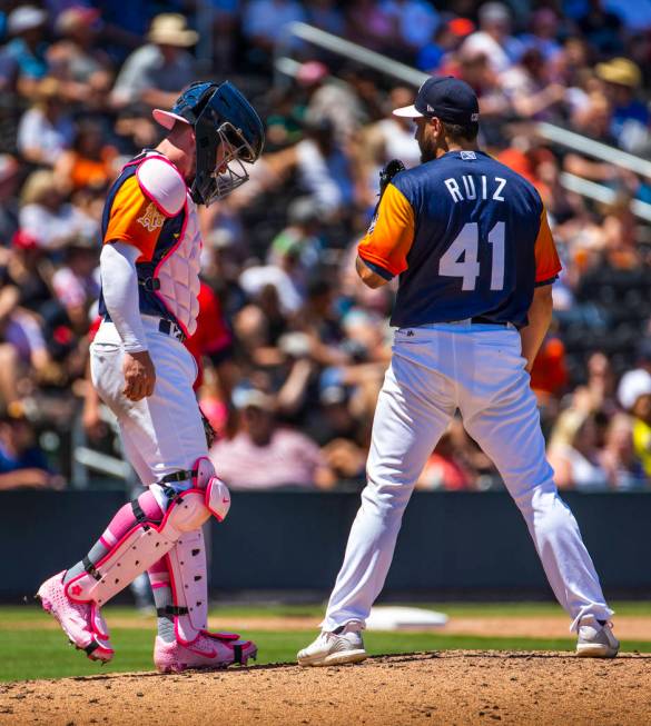 The Aviators Beau Taylor (6) comes out to the mound to consult with pitcher Norge Ruiz (41) dur ...