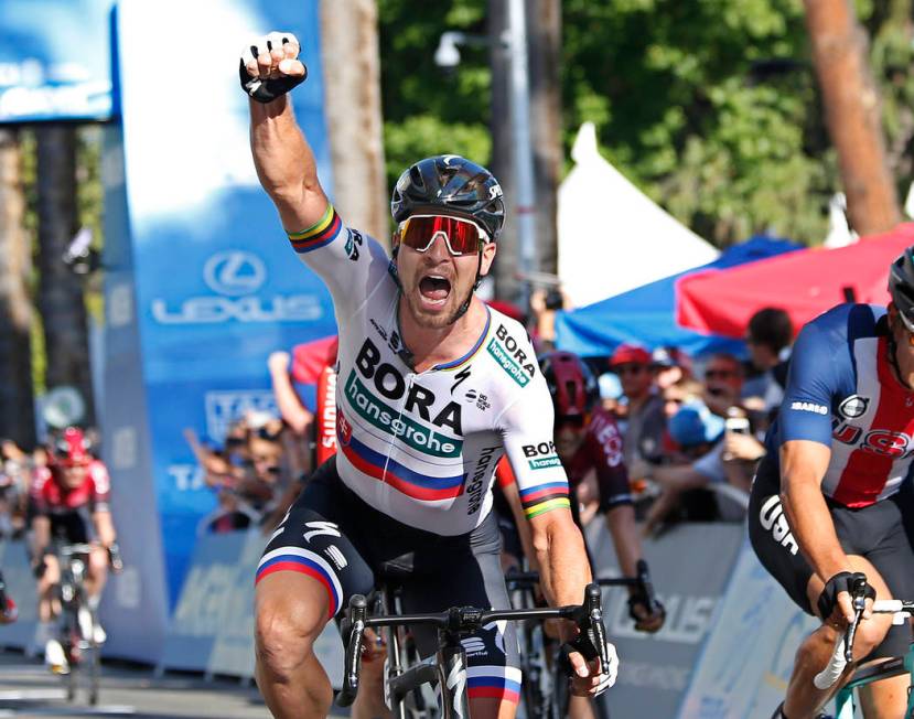 Peter Sagan, of the Bora-hansgrohe team, celebrates after crossing the finish line to win the f ...