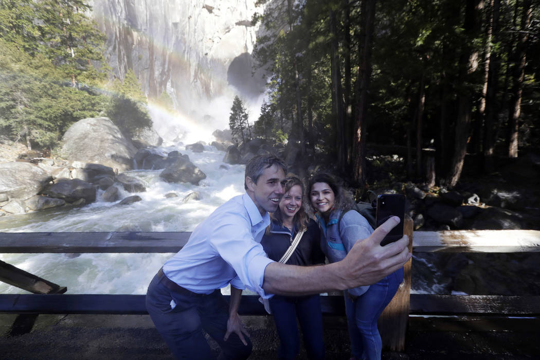 Beto O'Rourke, left, takes a selfie with Anne Kelly, center, Director of the Sierra Nevada Rese ...