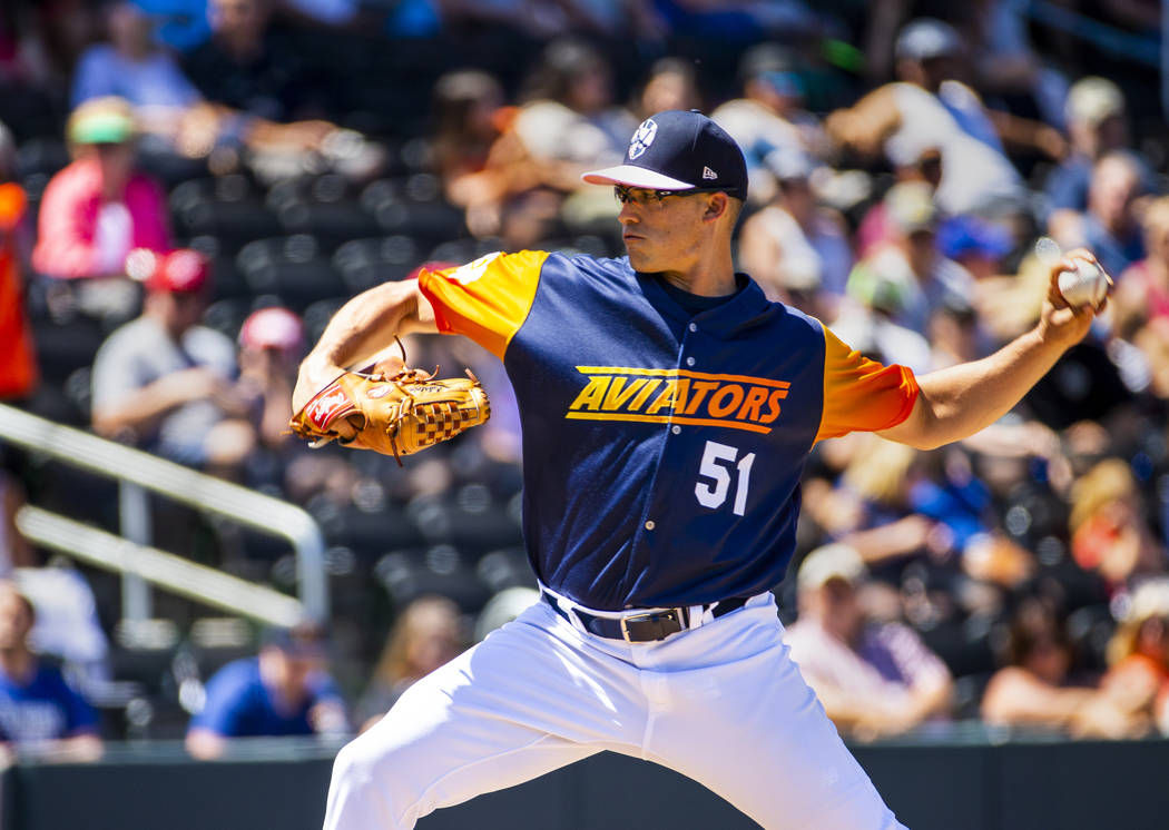 The Aviators pitcher Kyle Lobstein (51) winds up for another throw versus the Tacoma Rainiers a ...