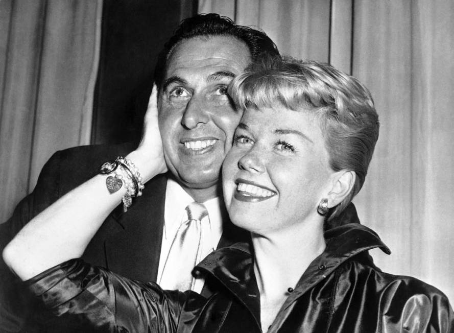 film actress and singer Doris Day poses with her husband and agent Martin Melcher at their hote ...