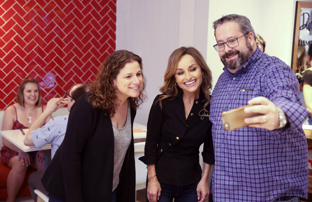 Giada De Laurentiis, center, visits with Jodie and Mark Silberman of Chicago at the start of Ap ...