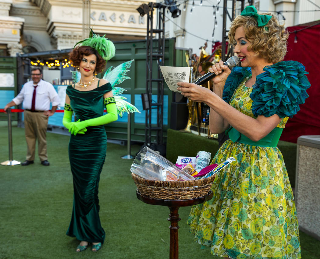 The Green Fairy looks to Wanda Widdles as she readies to create her own cocktail for guests dur ...