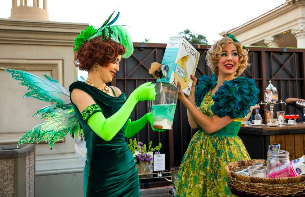 The Green Fairy assists Wanda Widdles as she creates her own cocktail for guests during a Vegas ...