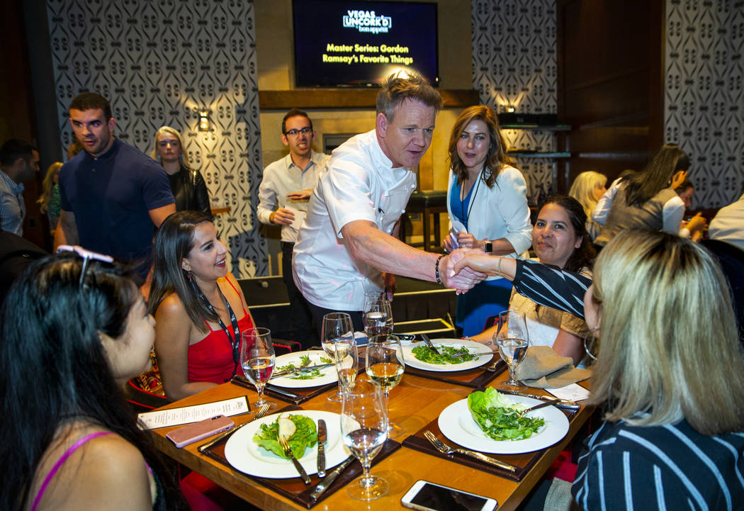 Chef Gordon Ramsay greets diners, from left, Jenn Tanaka, Shadia Asencio, Issa Plancarte and Gi ...