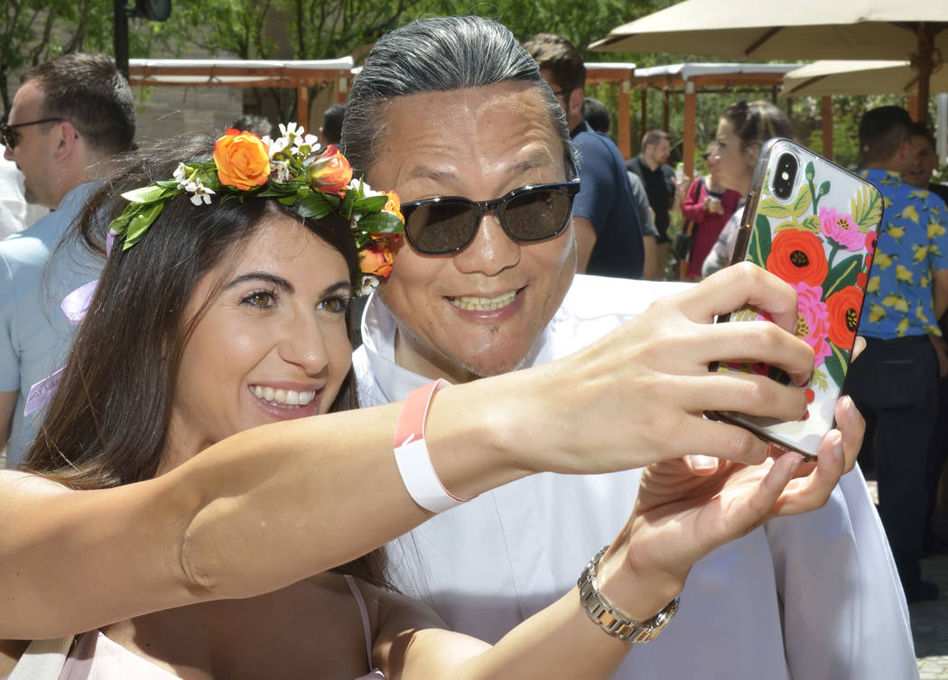 Domenica Danna takes a selfie with chef Masaharu Morimoto during Picnic in the Park at the Park ...