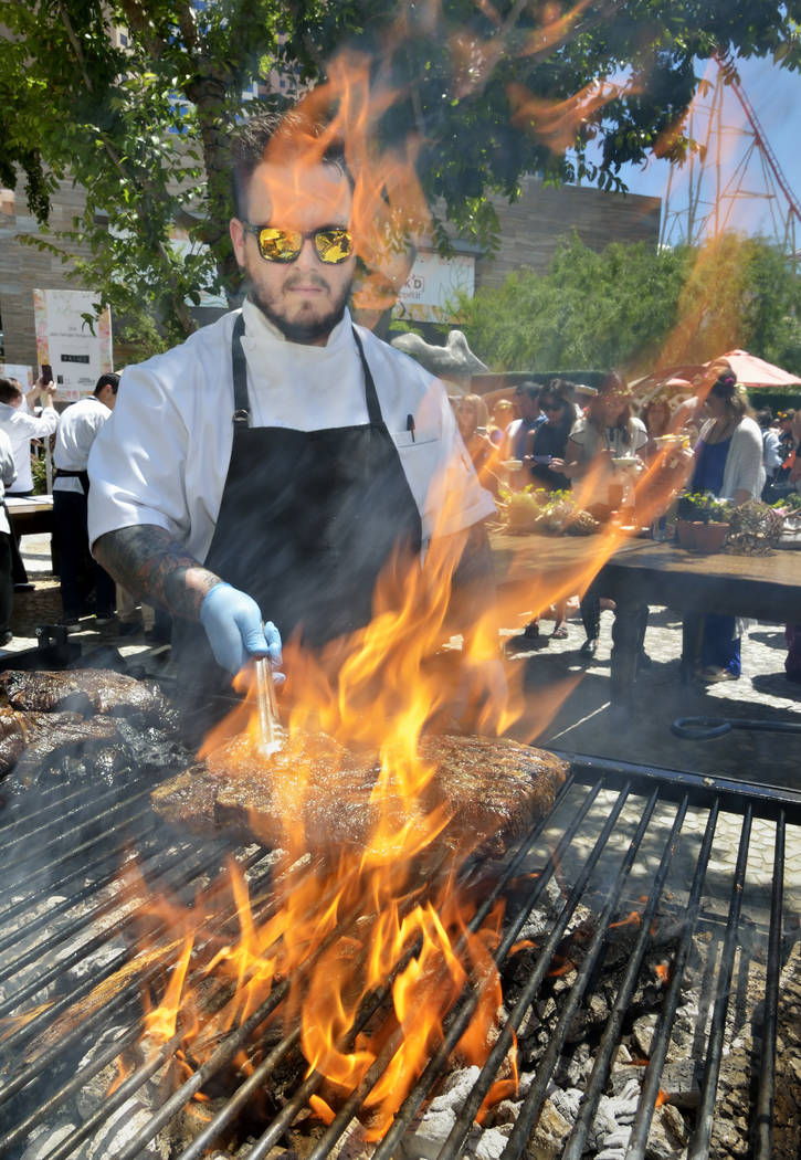 Chef Ryan Derieux of Voltaggio Brothers Steak House MGM National Harbor, cooks short ribs durin ...