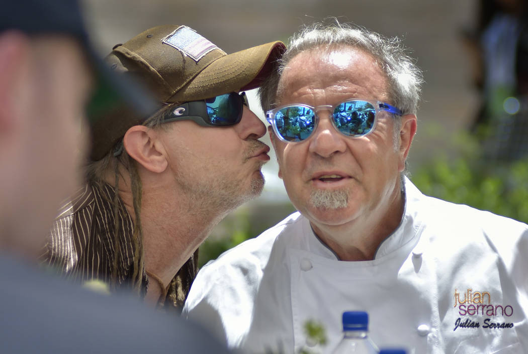 Chef Julian Serrano, right, gets a kiss from Andrea Boccardi during Picnic in the Park at the P ...