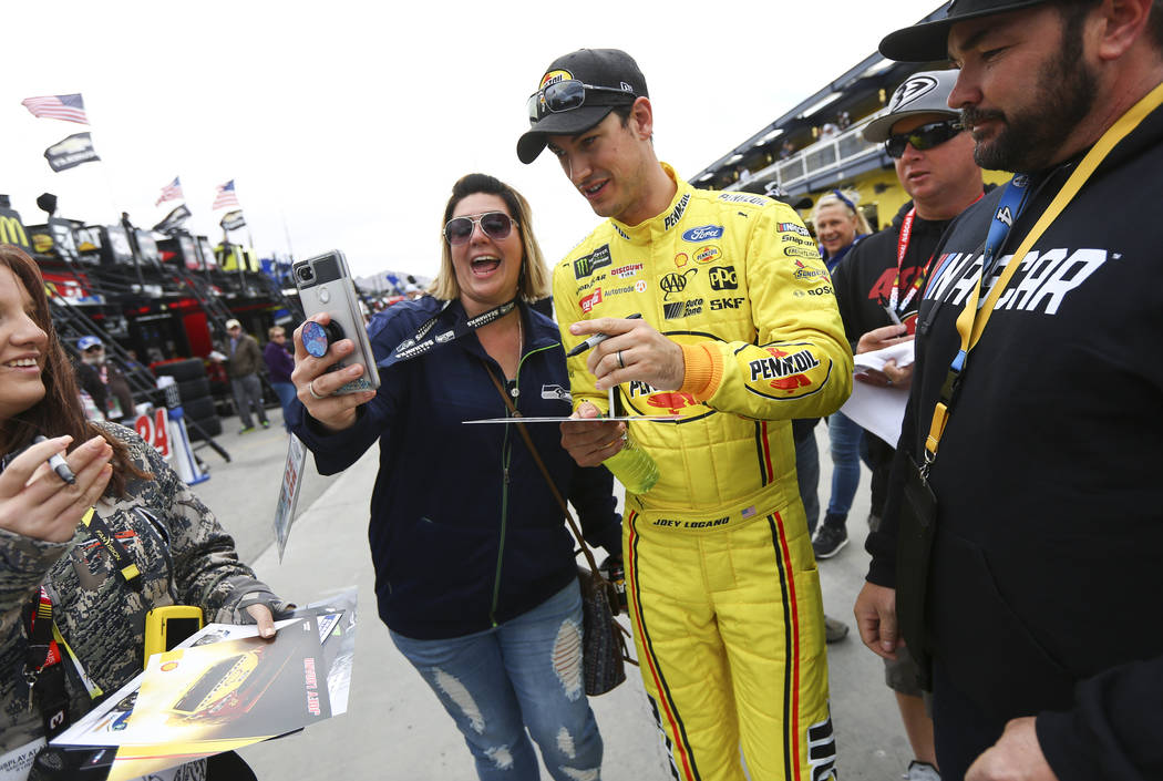 Monster Energy NASCAR Cup Series driver Joey Logano (22) takes a selfie with Liz Okeson of Ceda ...