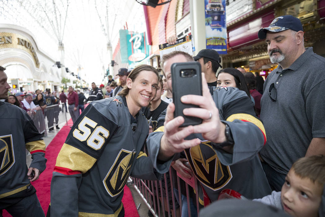 Vegas Golden Knights left wing Erik Haula (56) poses with fans during the team's first fan fest ...