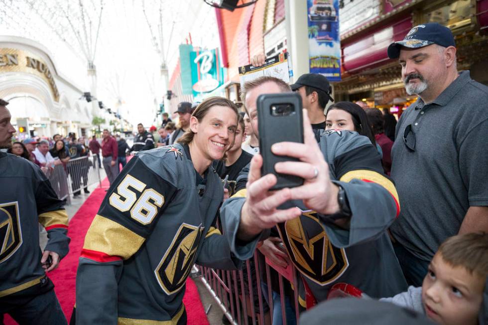 Vegas Golden Knights left wing Erik Haula (56) poses with fans during the team's first fan fest ...