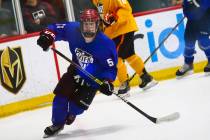 Team Blue's Matthew Gross (51) chases after the puck against Team Yellow during a game in the U ...