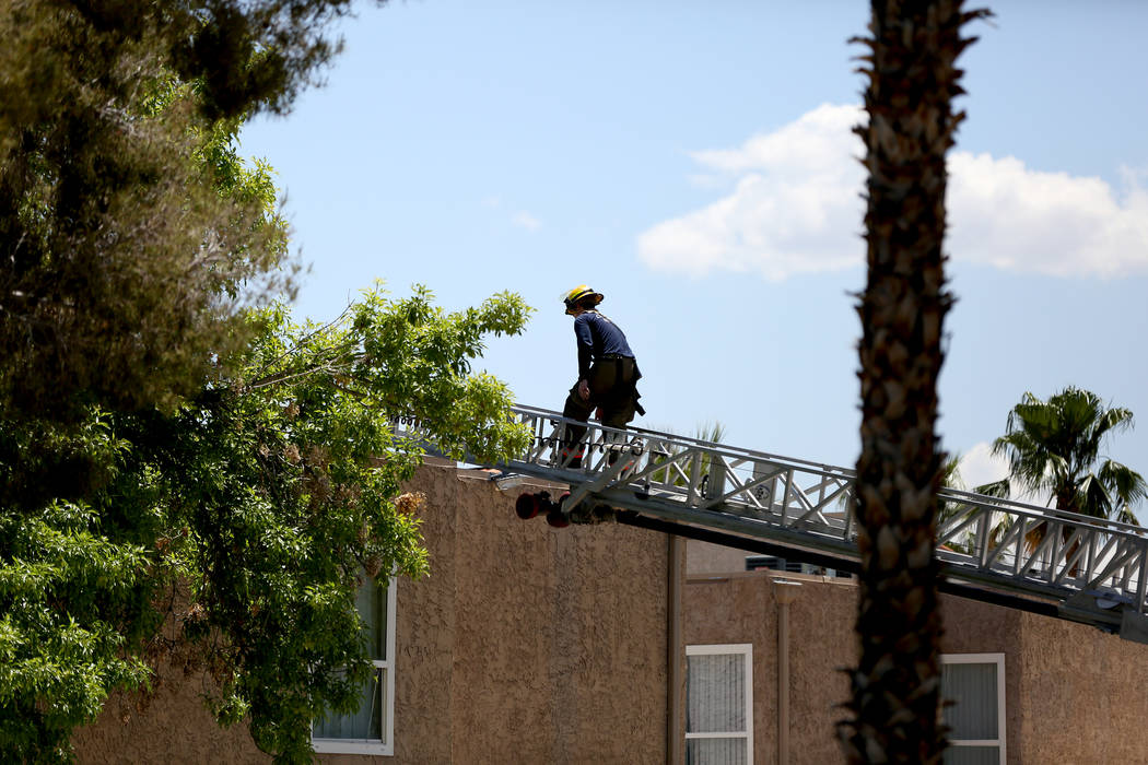 Firefighters respond to a two-alarm fire Monday morning, May 13, 2019 at an apartment building ...