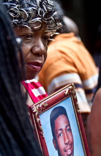 FILE - In this July 7, 2015, file photo, Gwen Carr holds a picture of her son Eric Garner durin ...