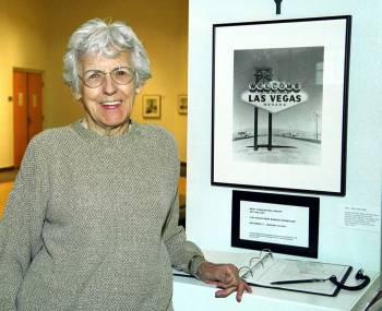 "Welcome to Las Vegas" sign designer Betty Willis poses with a photo of her sign at the West Ch ...