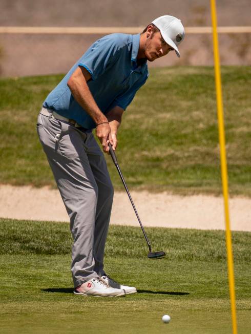 Golfer Van Thomas eyes a ball on the way to the hole during a PGA US Open qualifying round at t ...