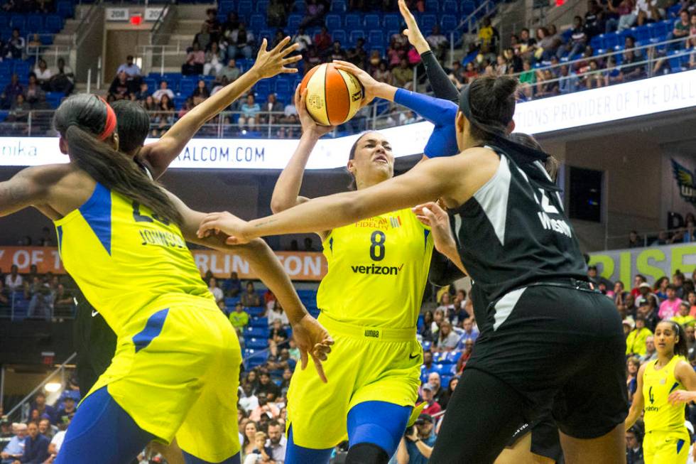 Dallas Wings center Liz Cambage (8) attempts to shoot a basket over Las Vegas forward A'ja Wils ...