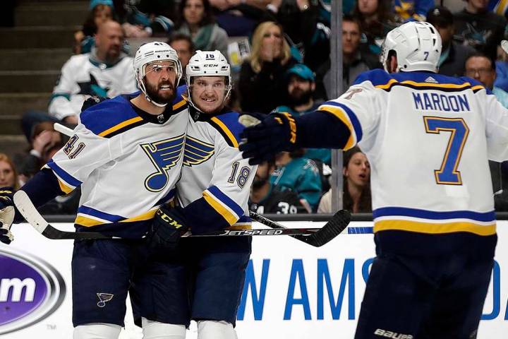 St. Louis Blues' Robert Bortuzzo, left, celebrates with teammates Robert Thomas (18) and Pat Ma ...