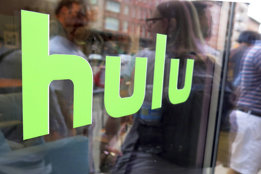 This June 27, 2015, file photo, shows the Hulu logo on a window at the Milk Studios space in Ne ...