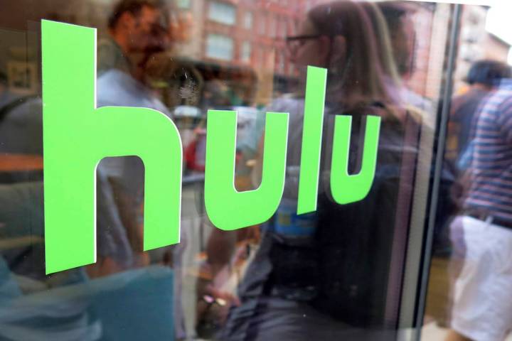 This June 27, 2015, file photo, shows the Hulu logo on a window at the Milk Studios space in Ne ...