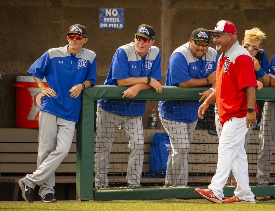 Longtime Las Vegas High coach Sam Thomas (right) talks up Basic coaches at an inning change dur ...