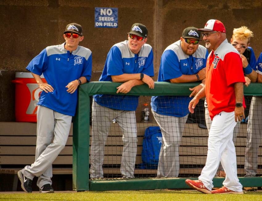 Longtime Las Vegas High coach Sam Thomas (right) talks up Basic coaches at an inning change dur ...