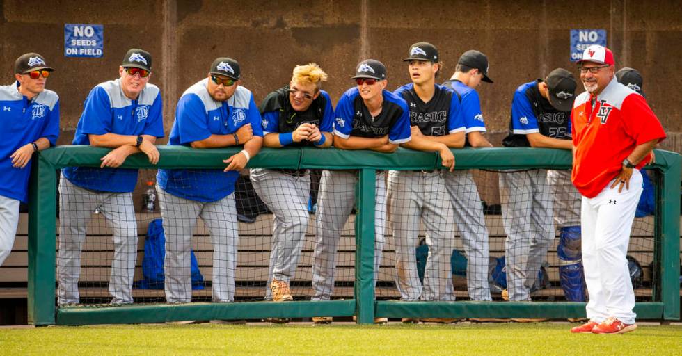 Longtime Las Vegas High coach Sam Thomas (right) talks up Basic coaches at an inning change dur ...