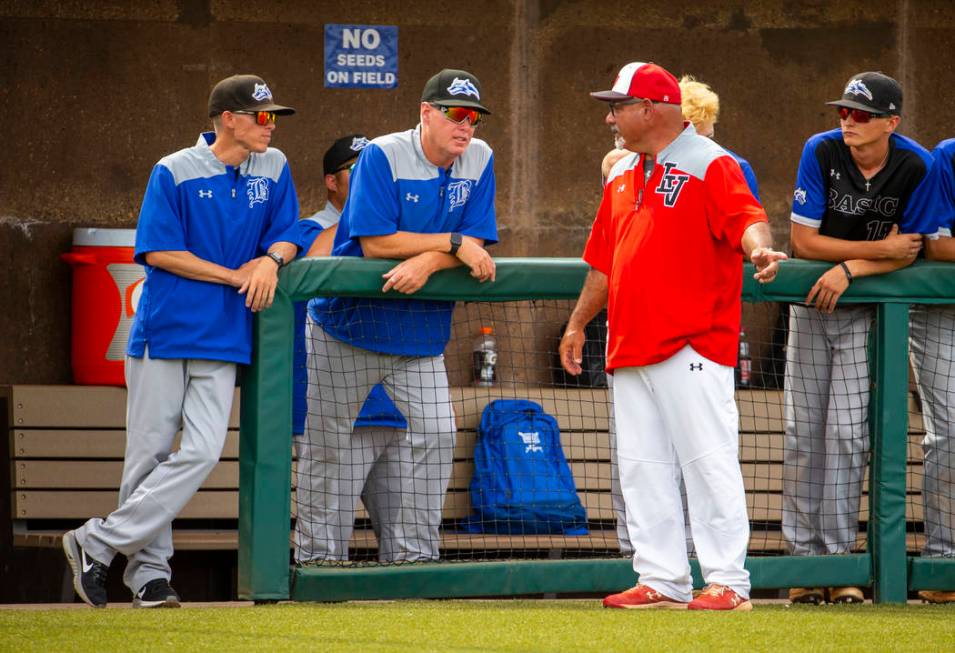 Longtime Las Vegas High coach Sam Thomas (right) talks up Basic coaches at an inning change dur ...