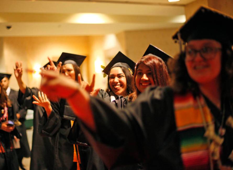 Students of the first graduating class for the new Deaf Studies program show signs of "I love y ...