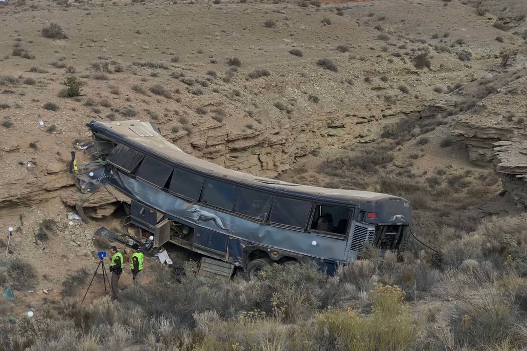 The aftermath of a late-Sunday Greyhound bus crash is seen on Monday, Jan. 1, 2018 in Emery Cou ...
