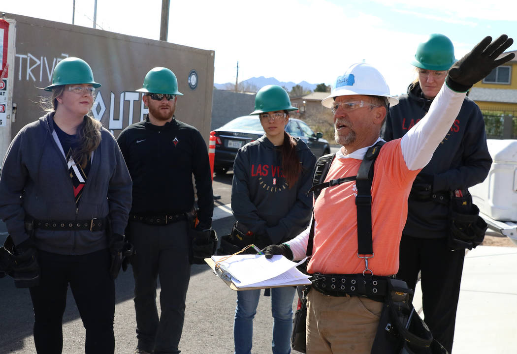 Las Vegas Aces center Carolyn Swords, right, and members of the Las Vegas Aces front office sta ...