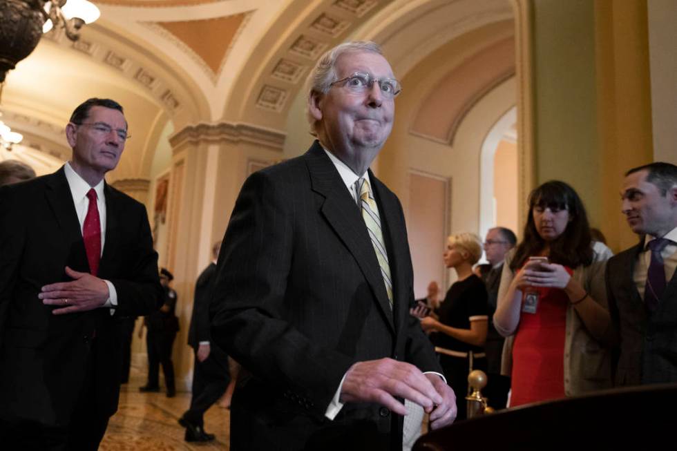 Senate Majority Leader Mitch McConnell, R-Ky., joined at left by Sen. John Barrasso, R-Wyo., an ...