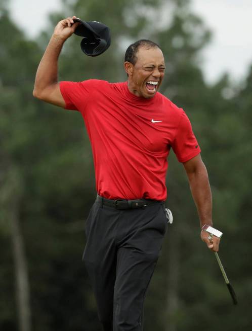 Tiger Woods reacts as he wins the Masters golf tournament Sunday, April 14, 2019, in Augusta, G ...