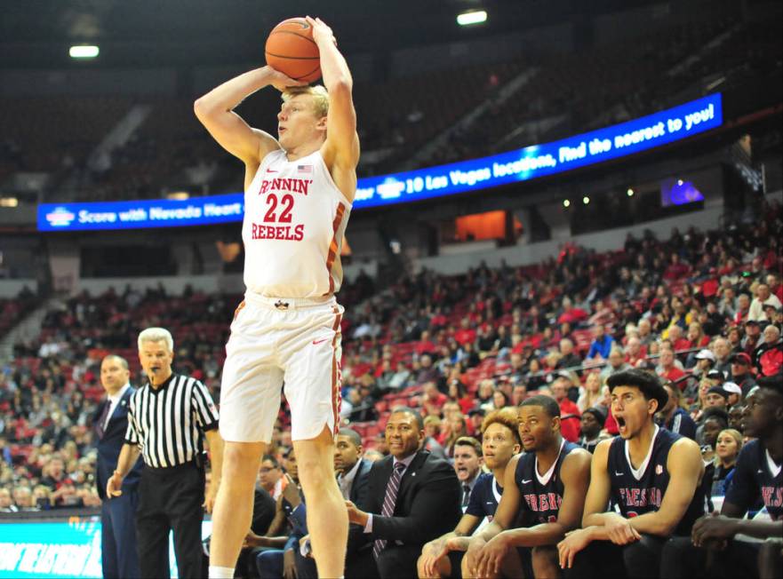 UNLV Rebels guard Trey Woodbury (22) takes a three-point shot during the first half of a game b ...