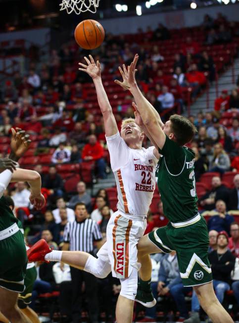 UNLV Rebels guard Trey Woodbury (22) shoots against Colorado State forward Adam Thistlewood (31 ...