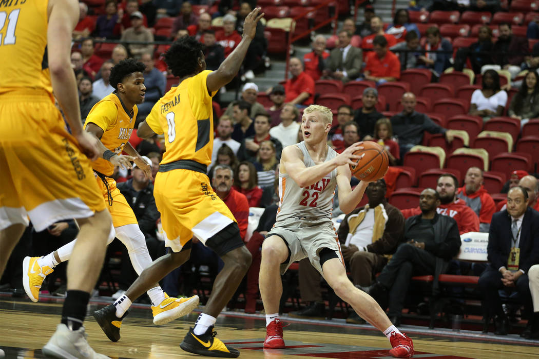 UNLV Rebels guard Trey Woodbury (22) looks for an open pass against Valparaiso Crusaders during ...
