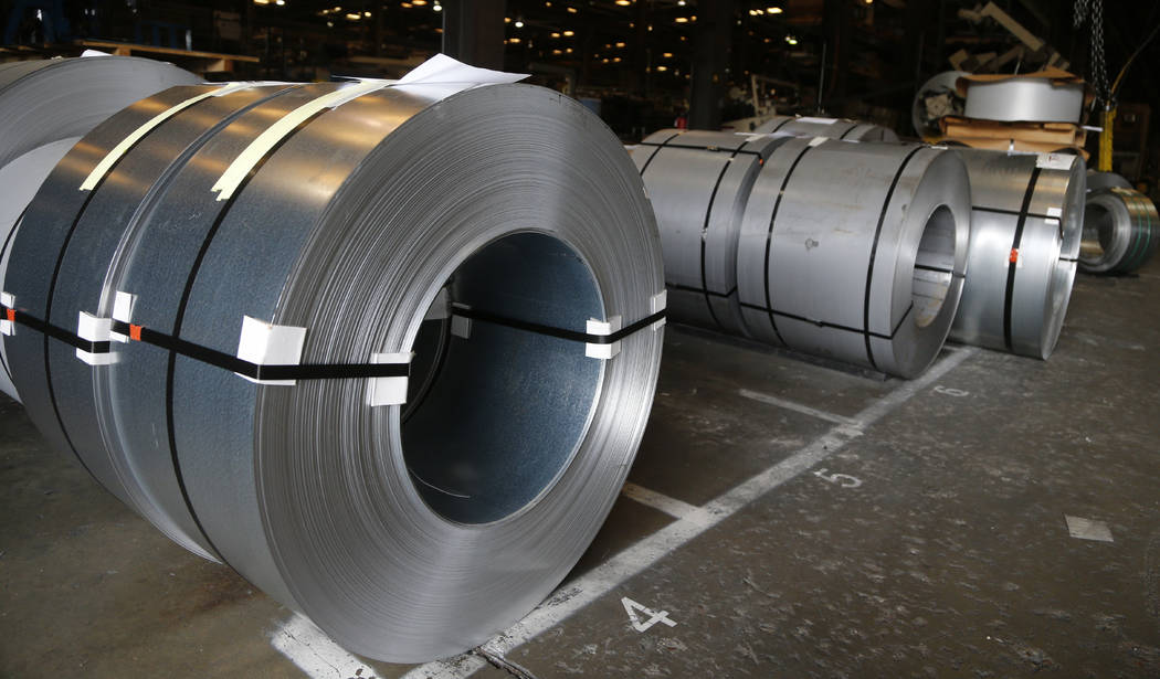 FILE - In this July 11, 2018, file photo rolls of steel sit in a warehouse at a fabrication com ...