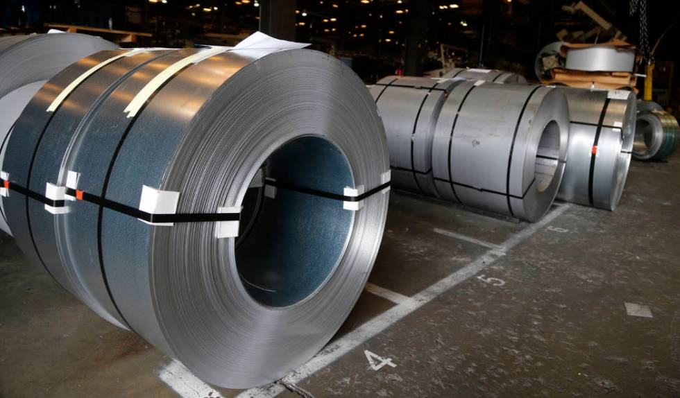 FILE - In this July 11, 2018, file photo rolls of steel sit in a warehouse at a fabrication com ...