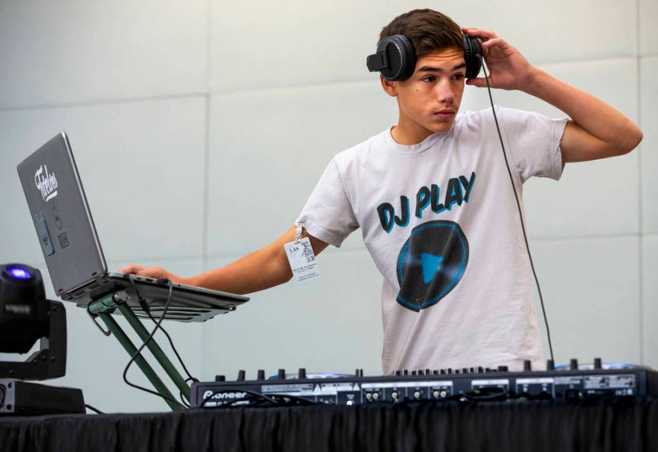 DJ Play performs for travelers including EDC visitors arriving through Terminal 3 at McCarran I ...