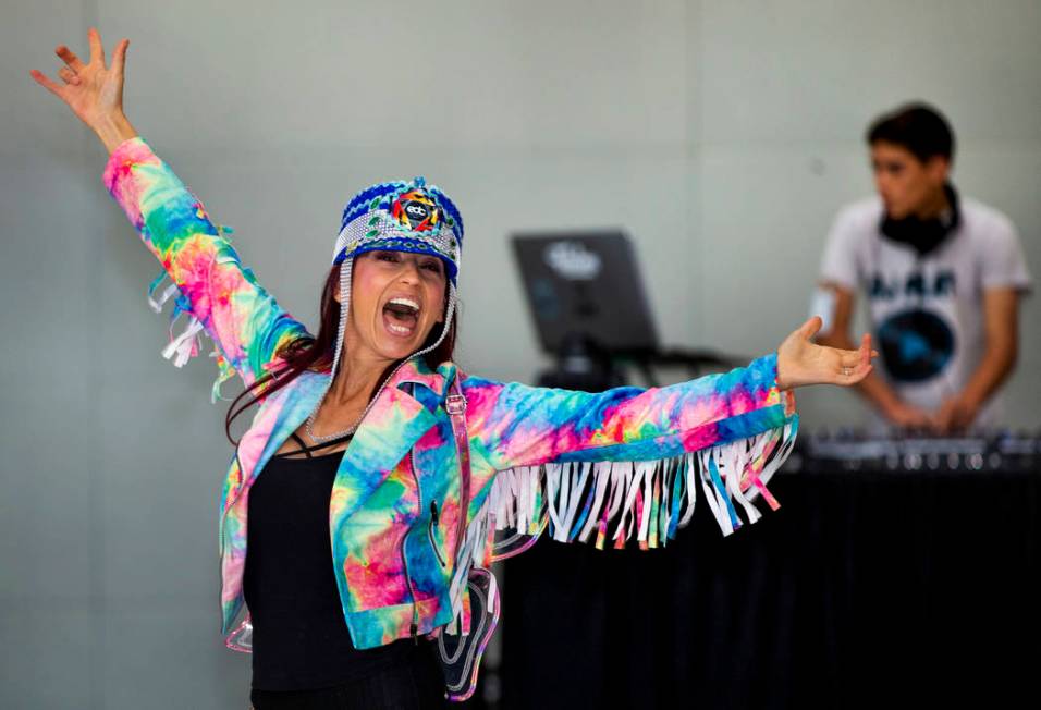 EDC traveler CarolinaWoodruff of Jacksonville, Florida, dances as DJ Play performs for visitors ...