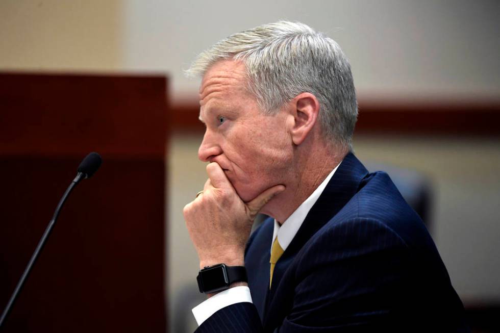 District Attorney George Brauchler listens as Devon Erickson, not pictured, appears at the Doug ...
