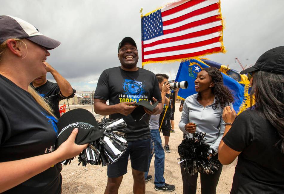 Terrence Thornton receives a new Raiders hat at the Las Vegas Stadium site during the Southern ...