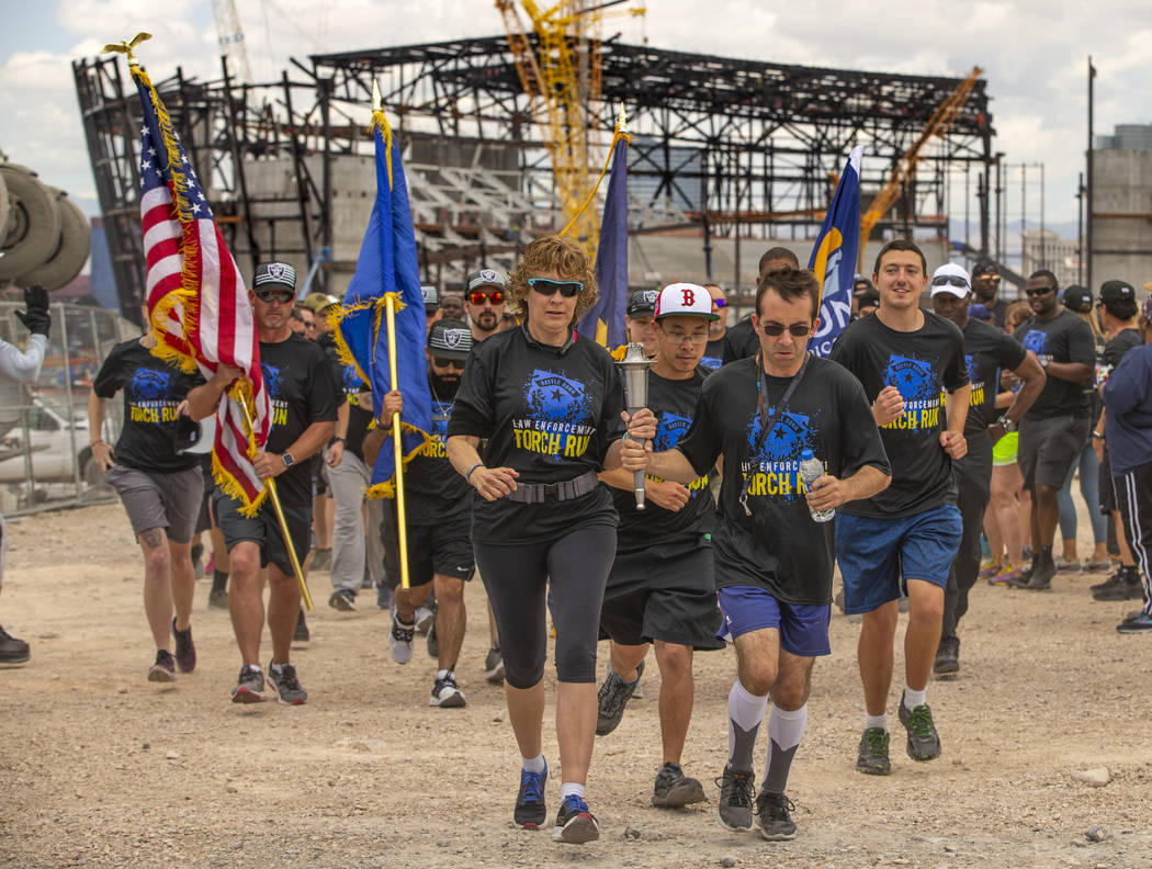 Nevada law enforcement officers and Special Olympics Nevada athletes run near the Las Vegas Sta ...