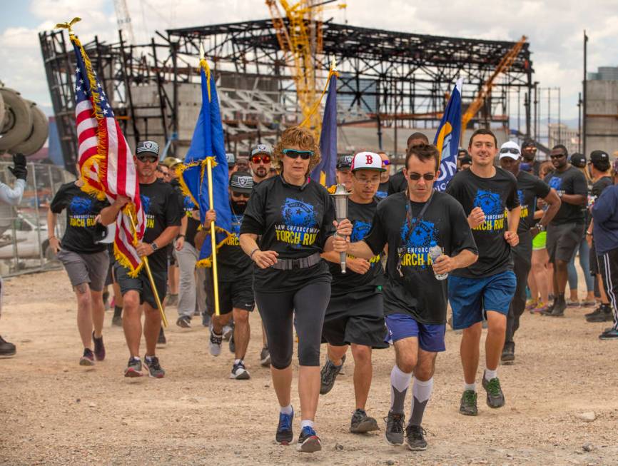 Nevada law enforcement officers and Special Olympics Nevada athletes run near the Las Vegas Sta ...