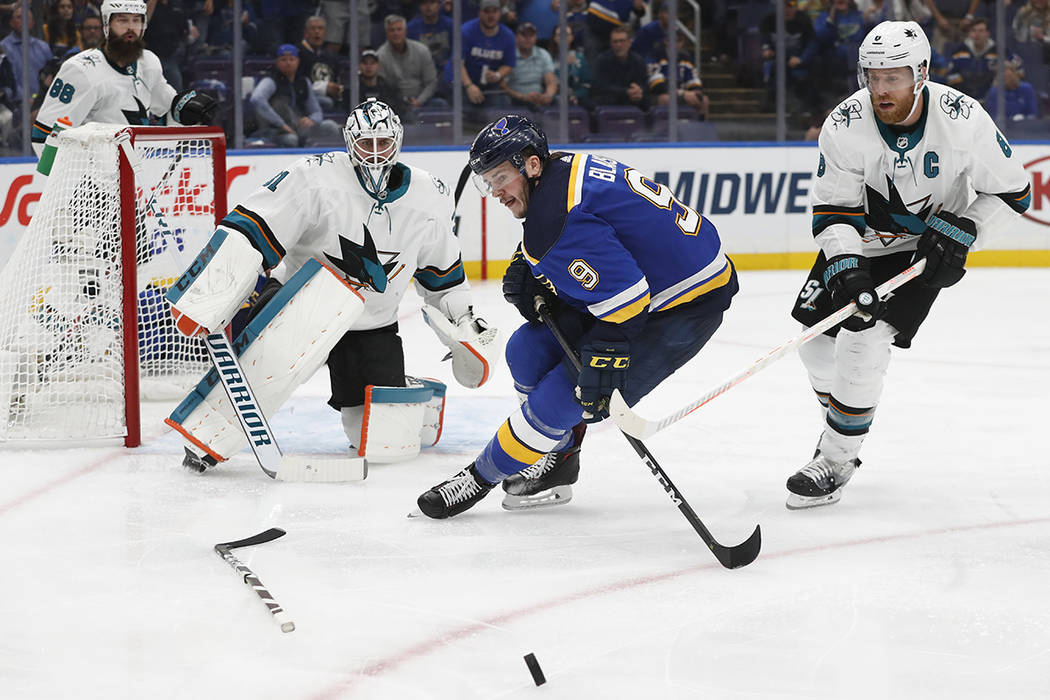 St. Louis Blues left wing Sammy Blais (9) chases the puck as it bounces away from San Jose Shar ...