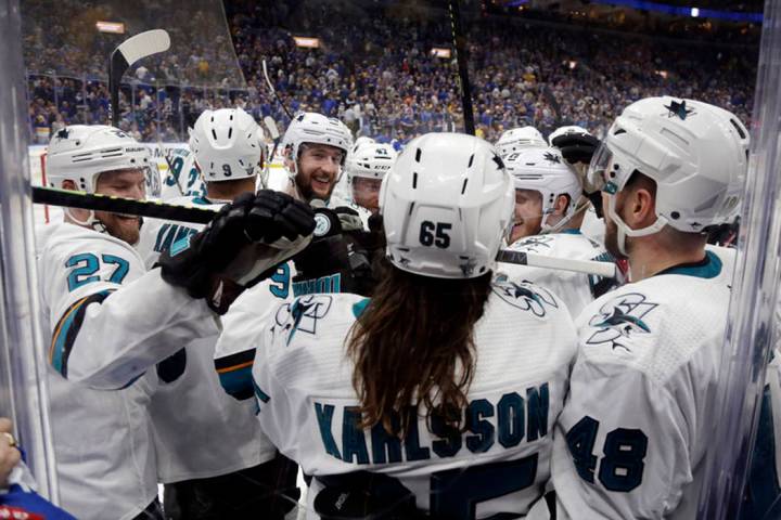 San Jose Sharks defenseman Erik Karlsson (65), of Sweden, is congratulated after scoring the wi ...