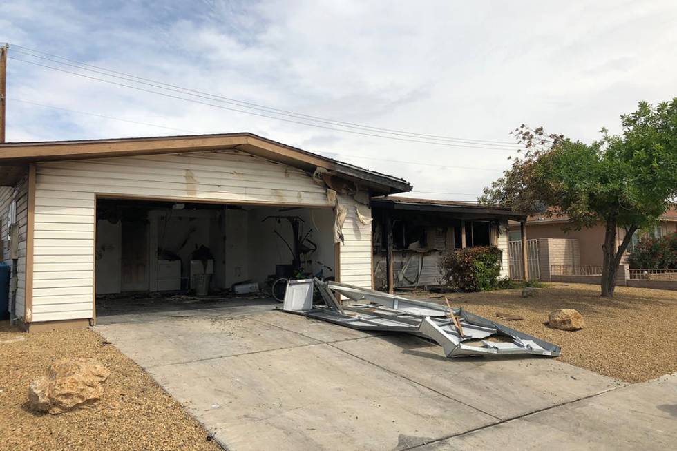 A home is heavily damaged by fire on the 1000 block of Joseph Kerwin Drive, near Charleston Bou ...