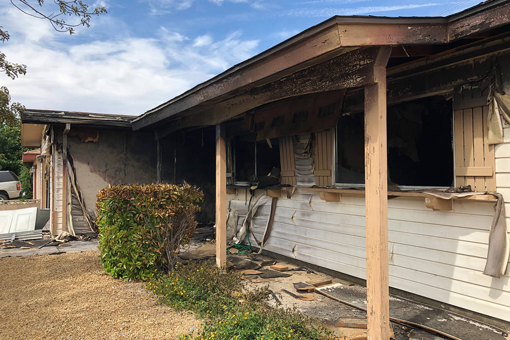 A home is heavily damaged by fire on the 1000 block of Joseph Kerwin Drive, near Charleston Bou ...